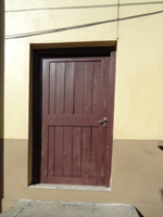 Before Unsecured Wooden Door
